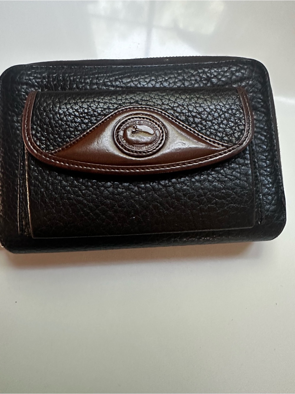 Dooney &Burke Brown and Black Leather Wallet with Classic Embossed Logo